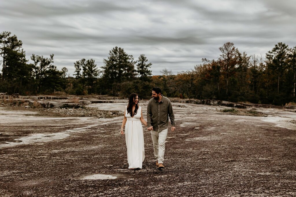 Mom and dad walking in the overcast at Arabia Mountain